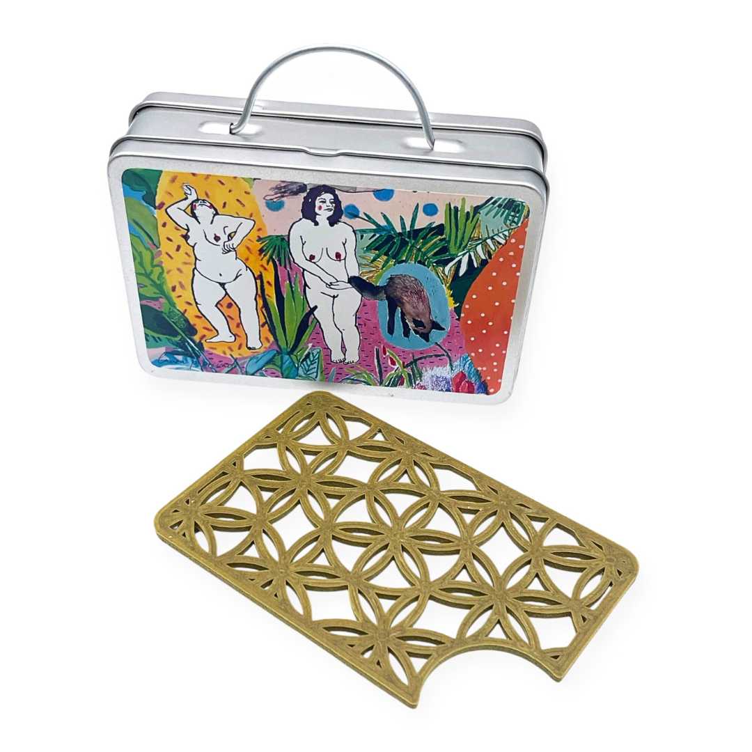 Travel soap box in the shape of a suitcase. Illustrated by Laura Privado
